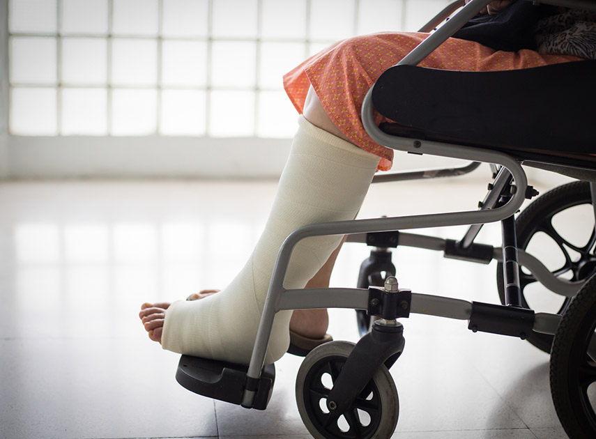 Adult-in-wheelchair-after-foot-and-ankle-fracture-surgery
