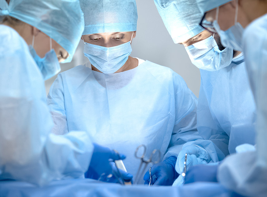 Surgical-team-performing-soft-tissue-reconstruction-surgery-in-operating-room
