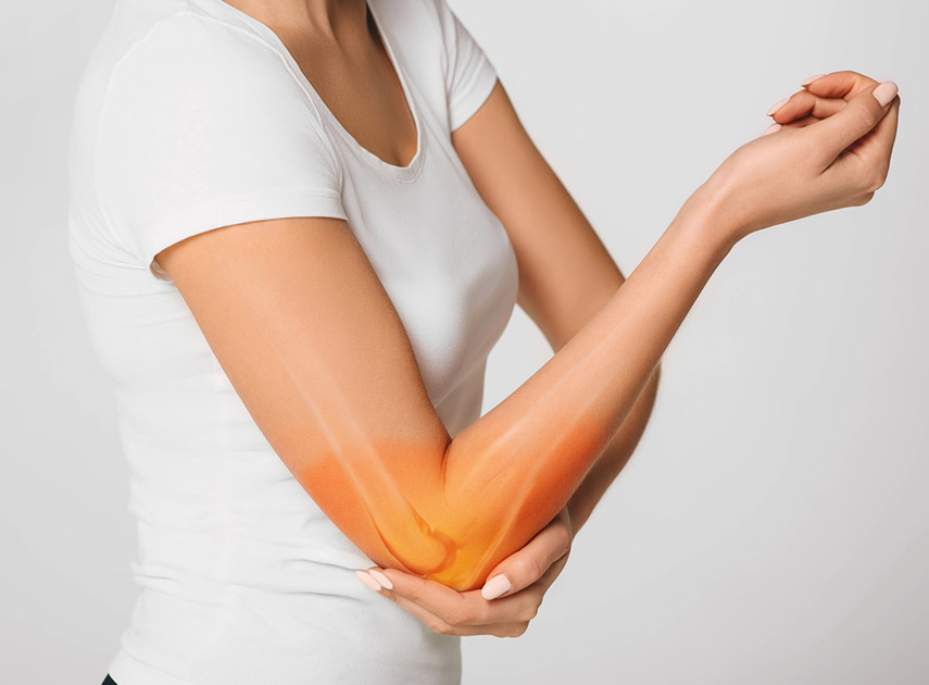 Woman-holding-her-elbow-in-pain-from-tendinitis